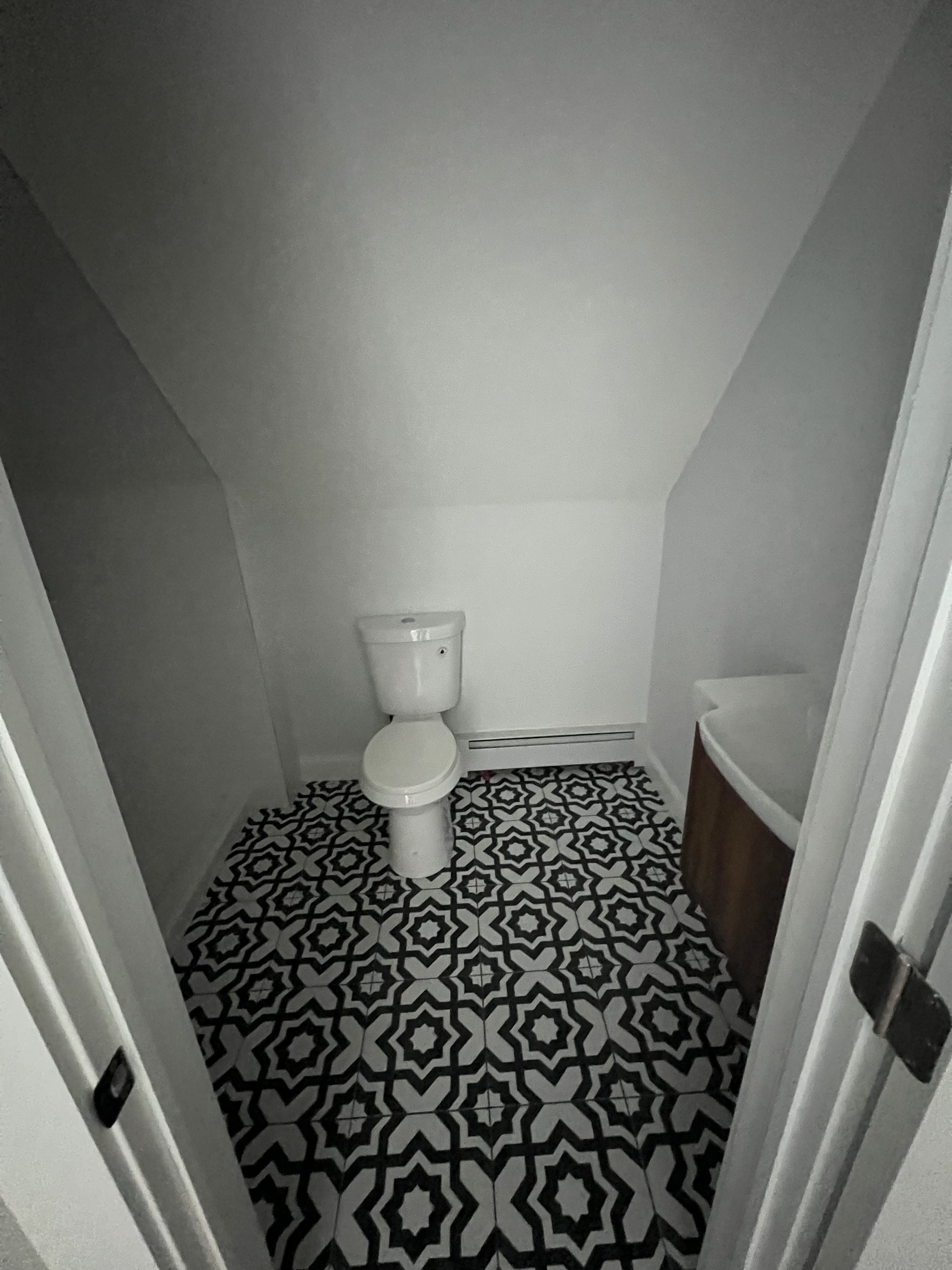 185 Maple Street, Unit 3 New Britain, CT 06051 - Photo 12 of 13 a bathroom with a black white checkered floor