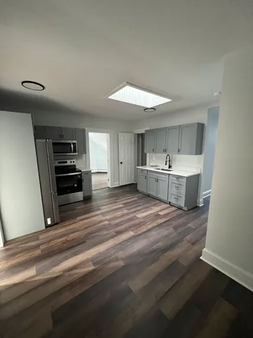 a room with a bed and cabinets