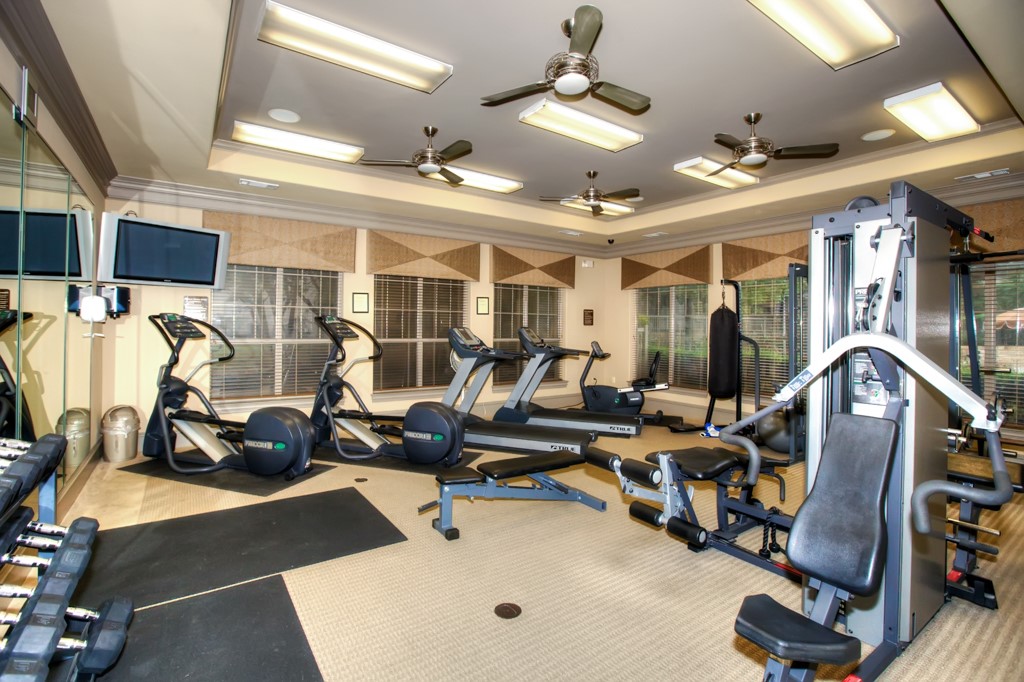 11203 Ranch Road 2222, Unit 1104 Austin, TX 78730 - Photo 21 of 23 Gym featuring crown molding and a raised ceiling