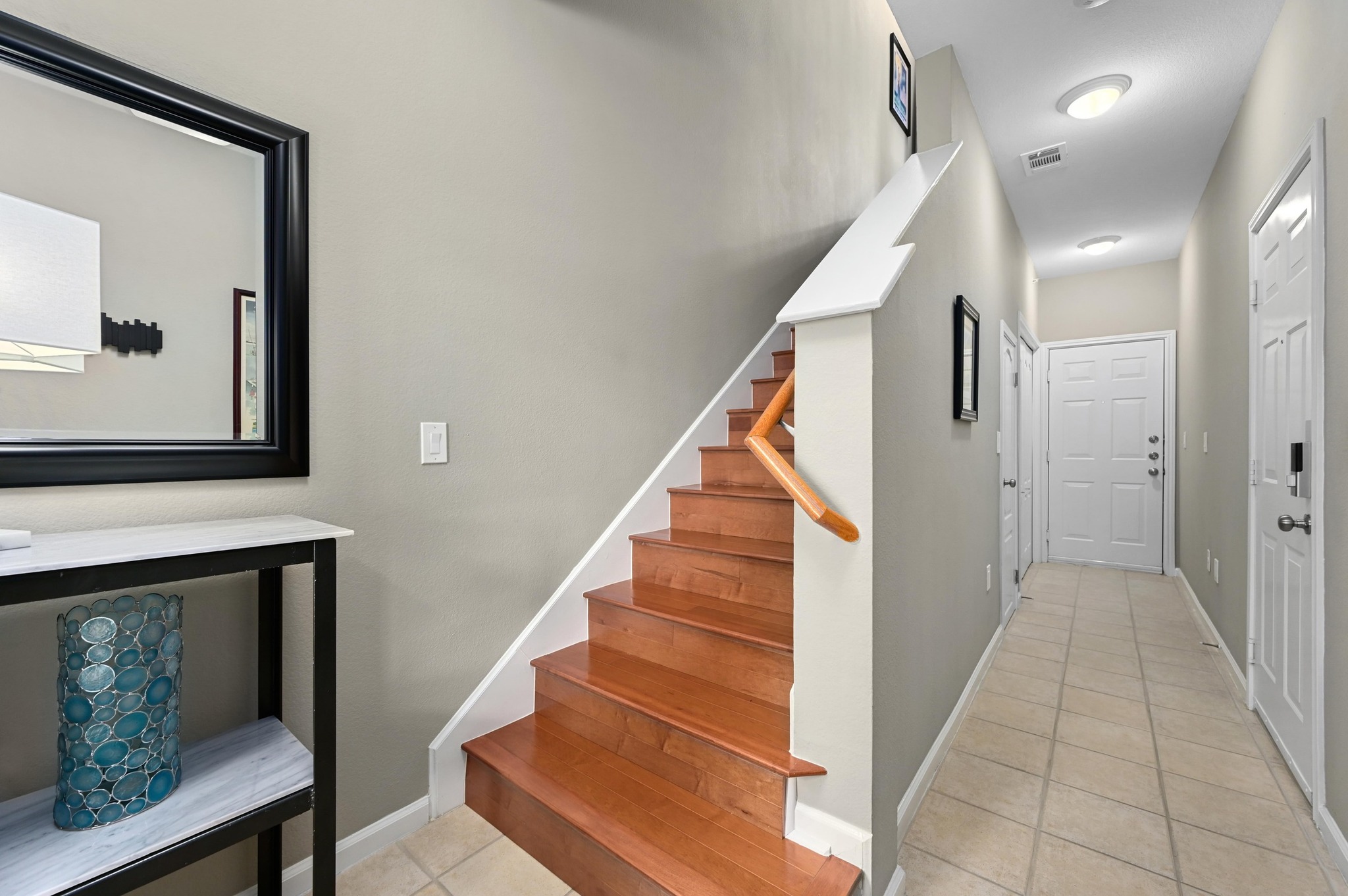 11203 Ranch Road 2222, Unit 1104 Austin, TX 78730 - Photo 5 of 23 Entry Foyer with second door to exterior yard and stairs to mail living area
