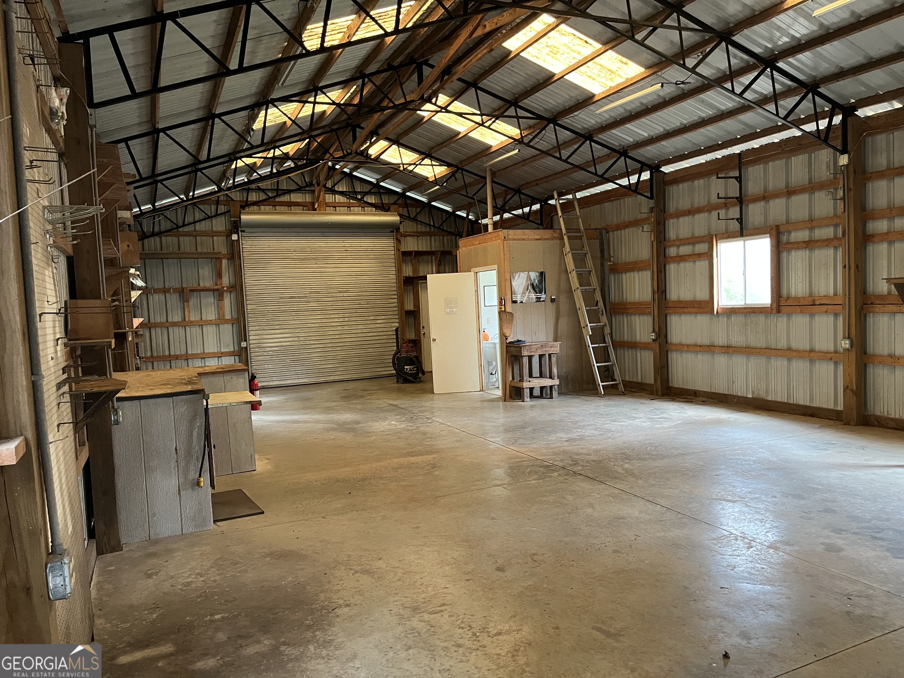 475 Davis Road Southwest Cave Spring, GA 30124 - Photo 7 of 27 a view of empty room with wooden ceiling
