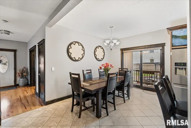 a living room with furniture a window and a fireplace
