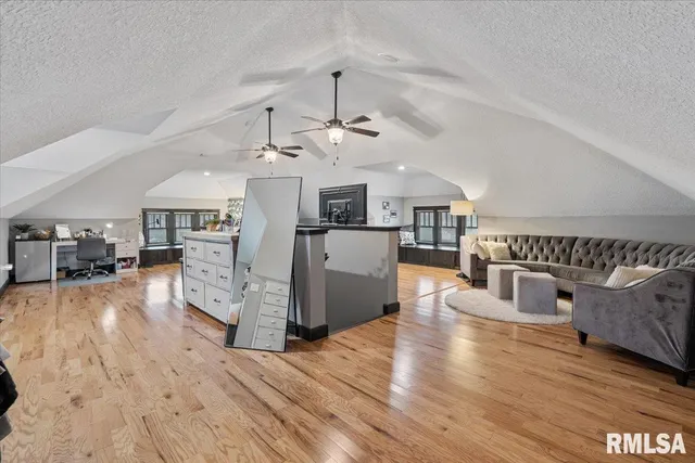a view of a house with backyard porch and sitting area