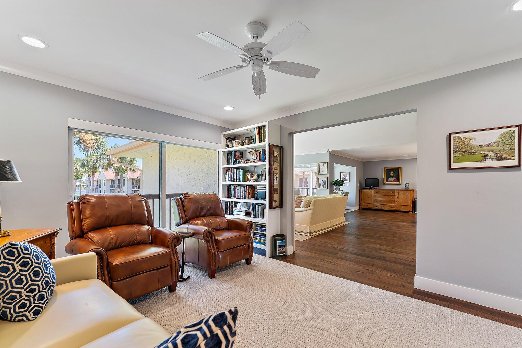 19101 Southeast Sea Turtle Court, Unit 202 Jupiter, FL 33469 - Photo 18 of 35 a living room with furniture and a window