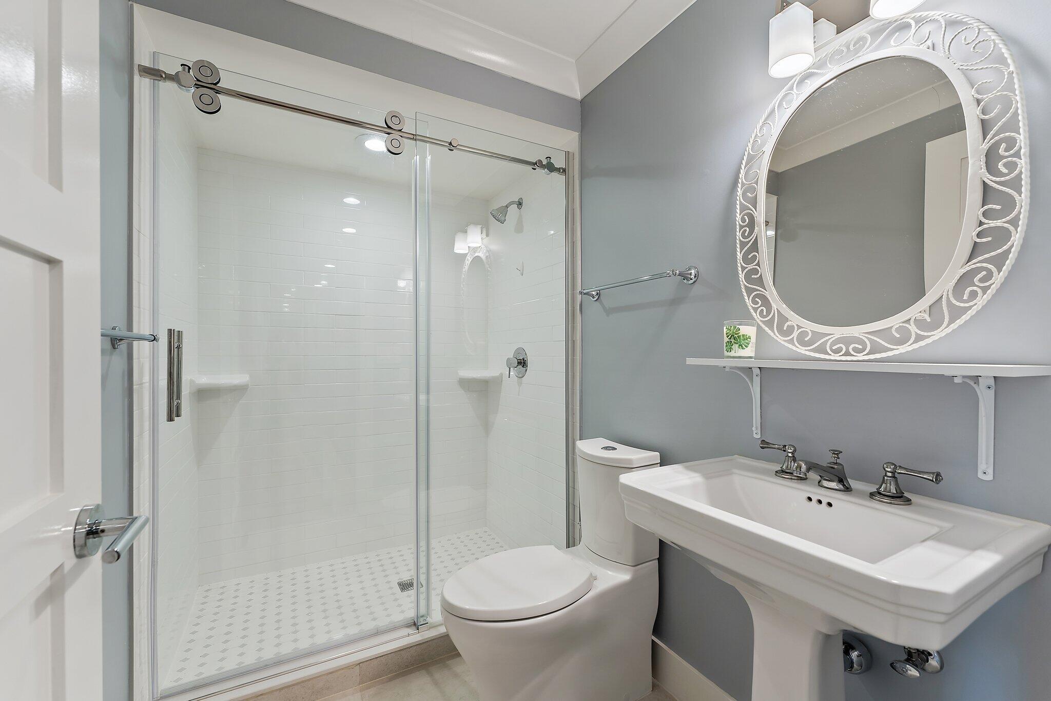 19101 Southeast Sea Turtle Court, Unit 202 Jupiter, FL 33469 - Photo 20 of 35 a bathroom with a sink and a mirror