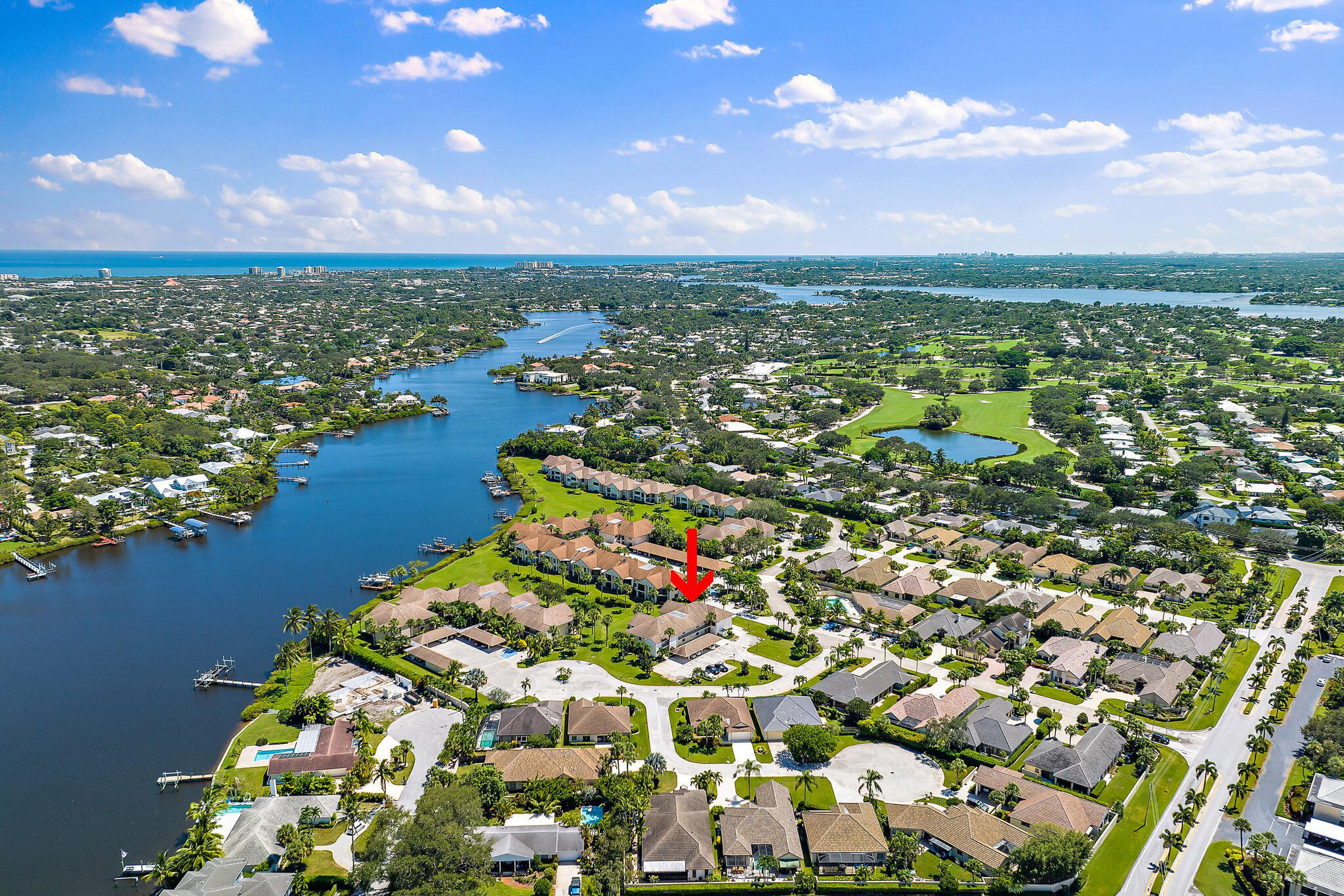 19101 Southeast Sea Turtle Court, Unit 202 Jupiter, FL 33469 - Photo 2 of 35 an aerial view of residential houses with outdoor space and trees