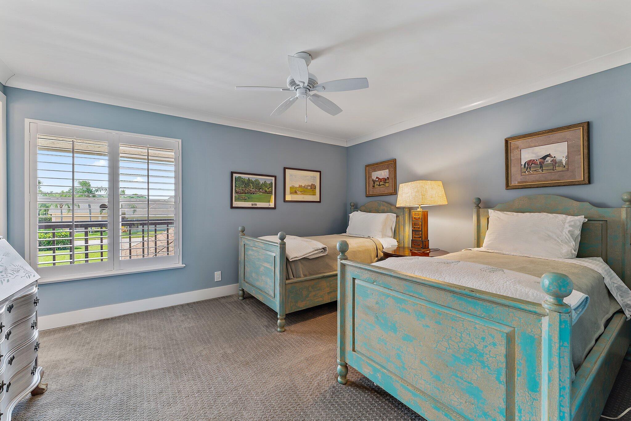 19101 Southeast Sea Turtle Court, Unit 202 Jupiter, FL 33469 - Photo 21 of 35 a bed room with a bed and a window