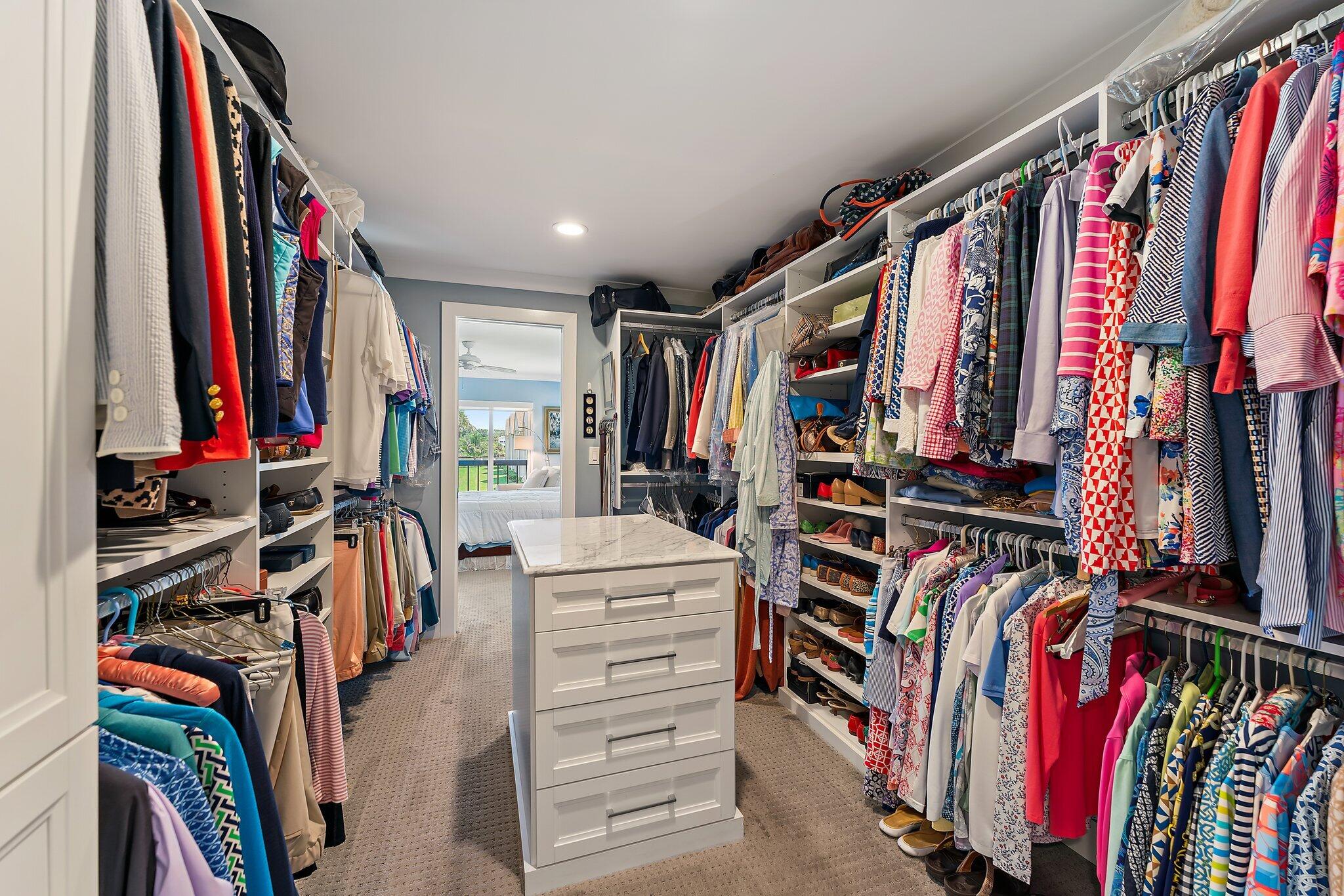 19101 Southeast Sea Turtle Court, Unit 202 Jupiter, FL 33469 - Photo 27 of 35 a view of walk in closet with clothes