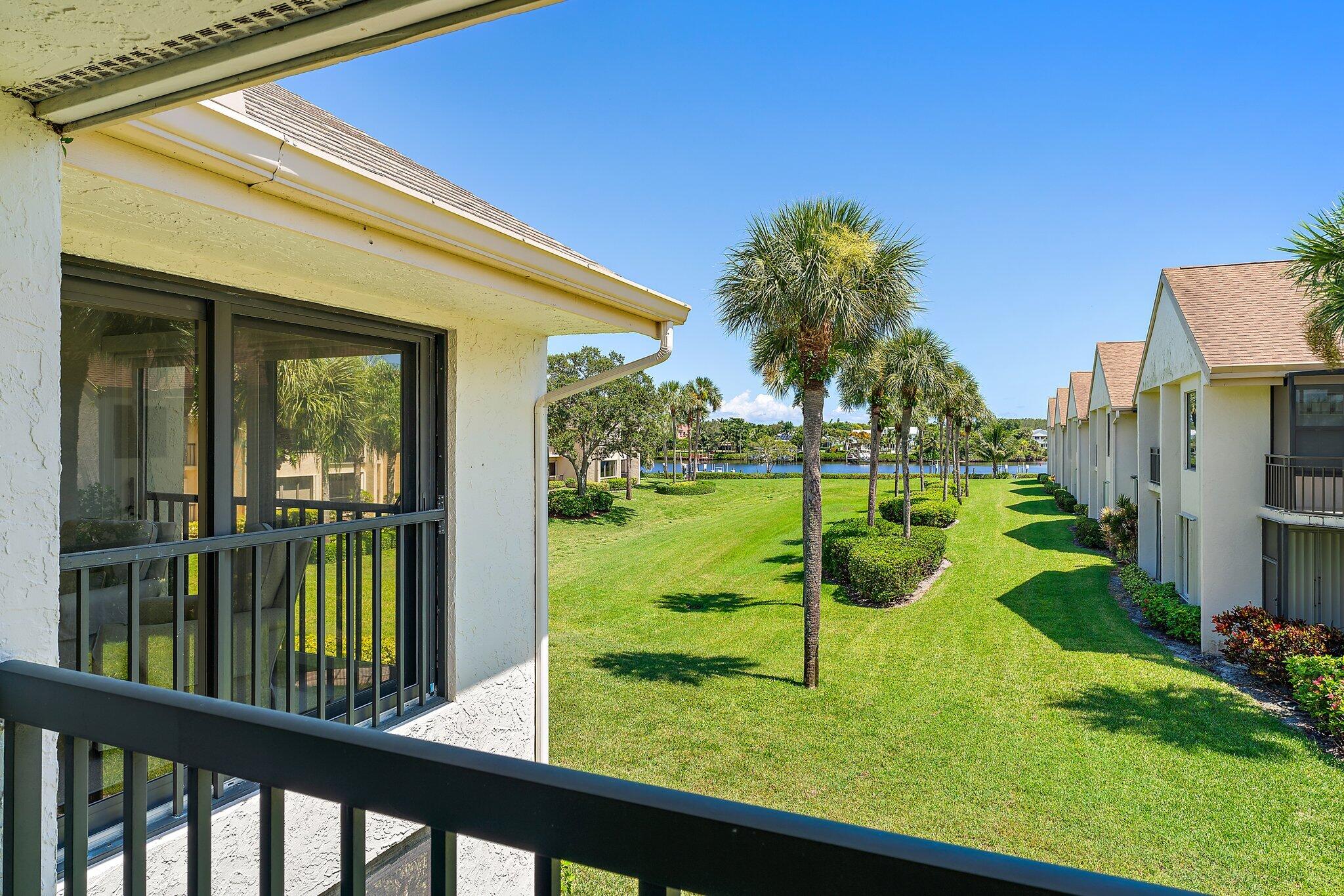 19101 Southeast Sea Turtle Court, Unit 202 Jupiter, FL 33469 - Photo 31 of 35 a view of a porch and a yard