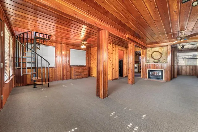 a view of a hallway with seating space