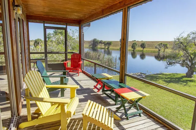 a view of swimming pool with a lounge chairs