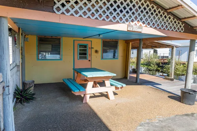 an outdoor space with furniture and umbrella