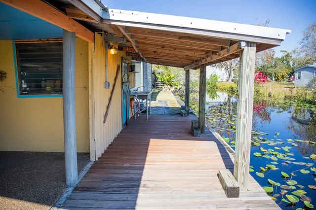 a view of a porch with wooden floor