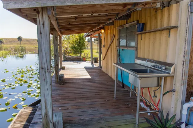 a view of balcony with wooden floor