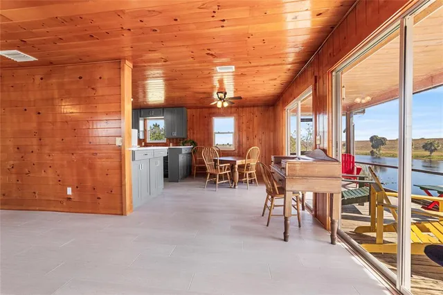 a view of a patio with a table and chairs