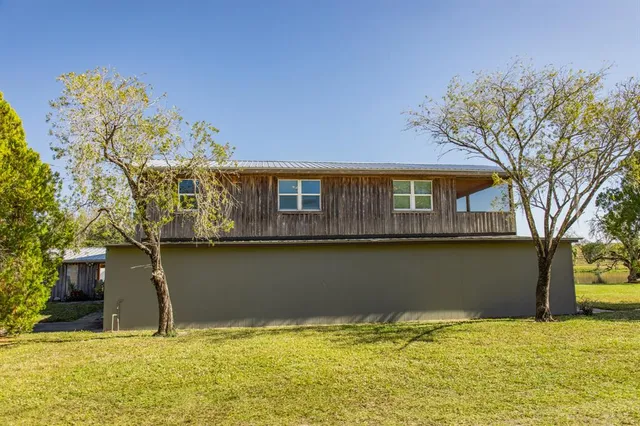 a house with river in front of it