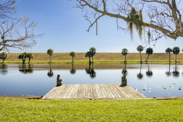 a view of swimming pool with outdoor seating