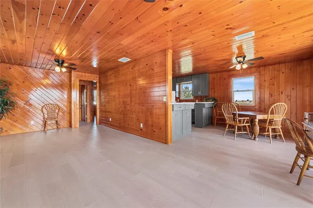 a view of a patio with furniture and backyard