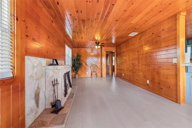 a view of a patio with wooden fence