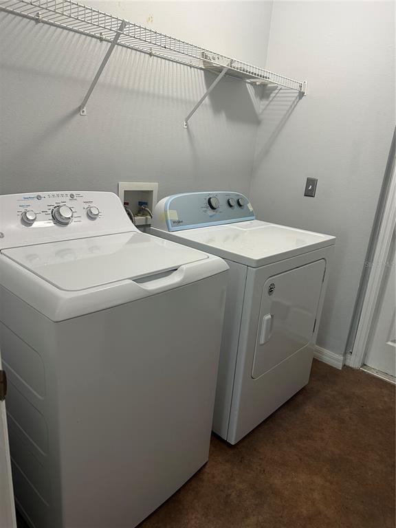 3078 Barbados Lane Haines City, FL 33844 - Photo 11 of 14 a utility room with dryer and washer