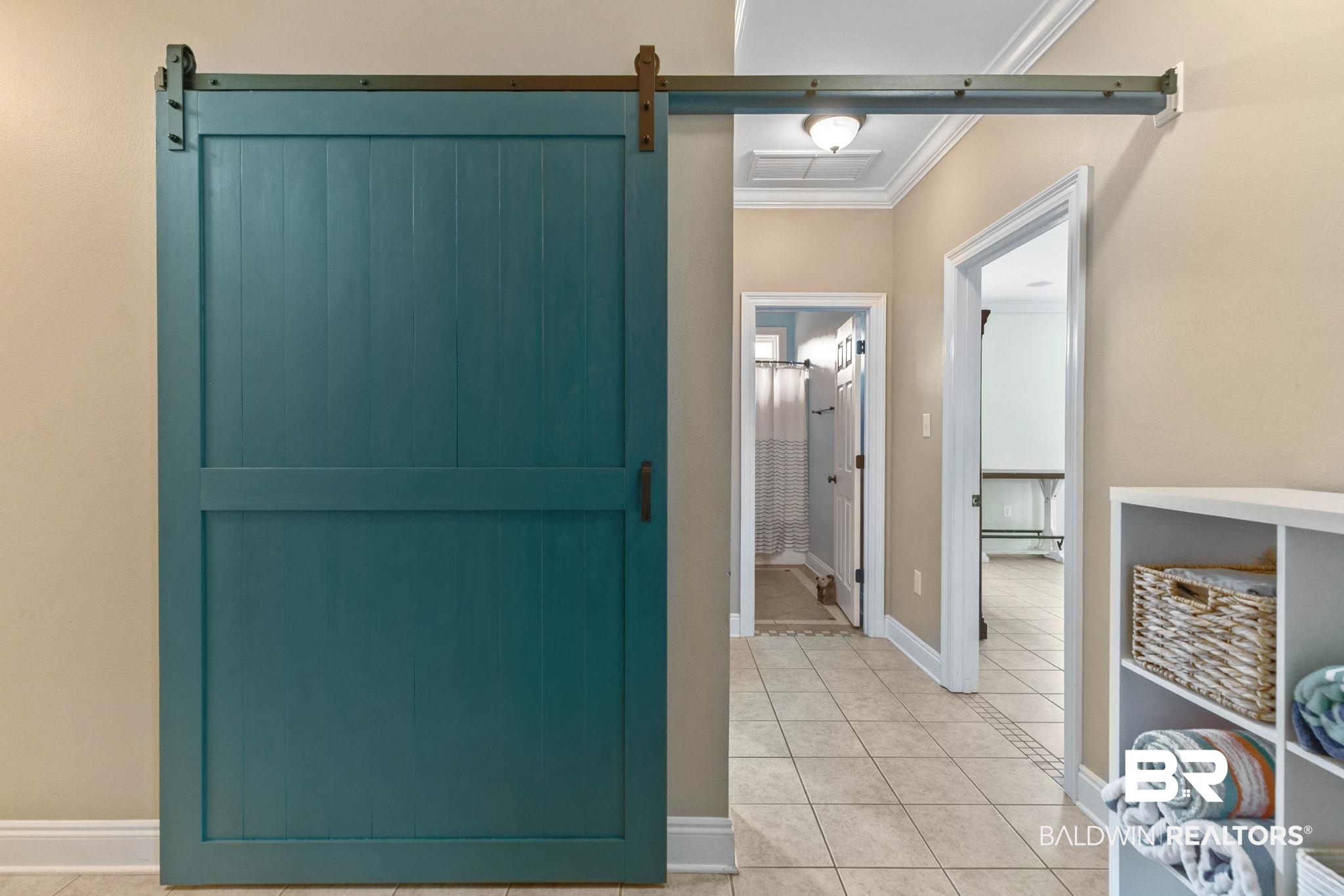 3668 Claridge Road North Mobile, AL 36608 - Photo 78 of 100 Hall with light tile patterned floors, crown molding, and a barn door
