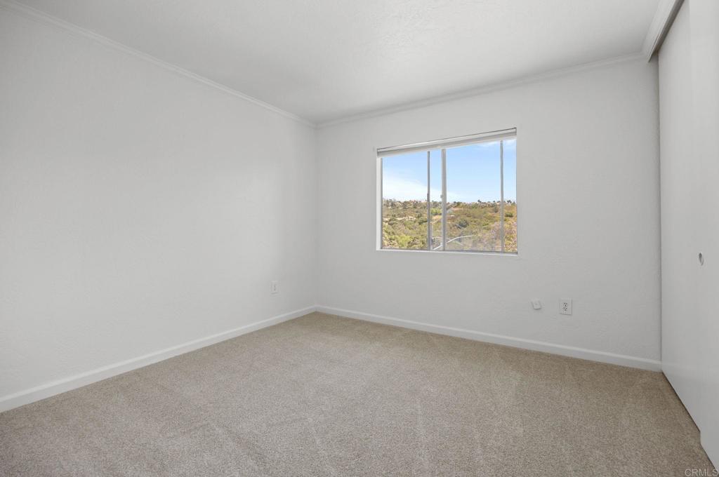 4595 Blackwell Road Oceanside, CA 92056 - Photo 32 of 47 an empty room with a window