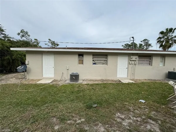 a house with trees in the background