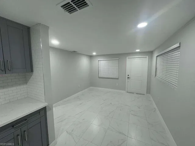 an empty room with windows