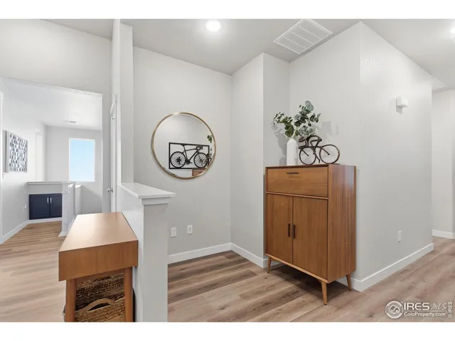 a living room with a furniture and a potted plant