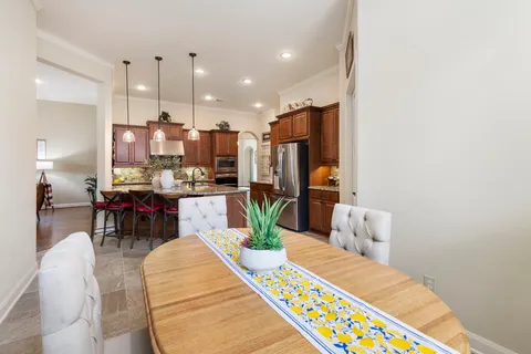 a living room with dining room and wooden floor