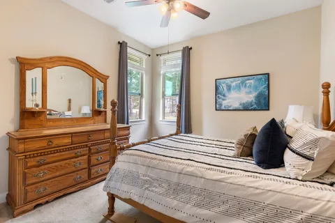 a bedroom with a bed and a dresser