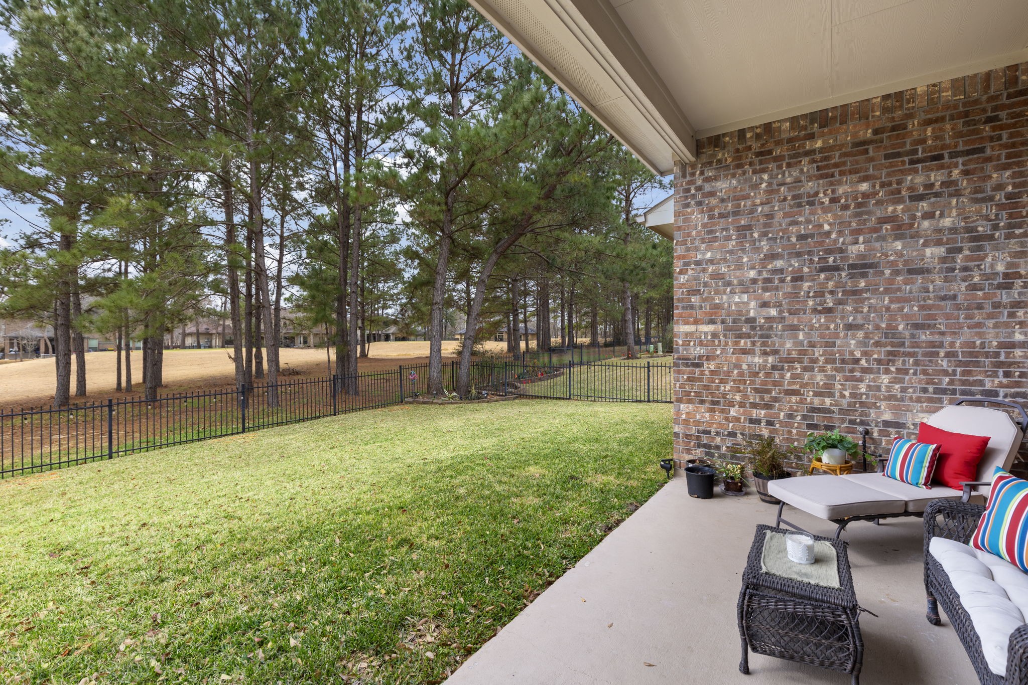 4787 Jackson Square Drive Conroe, TX 77304 - Photo 33 of 41 Step into the backyard, and let the tranquility wash over you. Your gaze drifts across the lush green expanse of the golf course, framed by mature trees swaying gently in the breeze. The soothing sounds of nature surround you—birds chirping melodiously, squirrels darting playfully among the branches. It’s a peaceful retreat, inviting you to sit, unwind, and savor the serenity of this idyllic outdoor haven.
