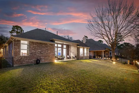 a view of a building with a yard