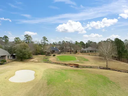 a view of a swimming pool with a yard