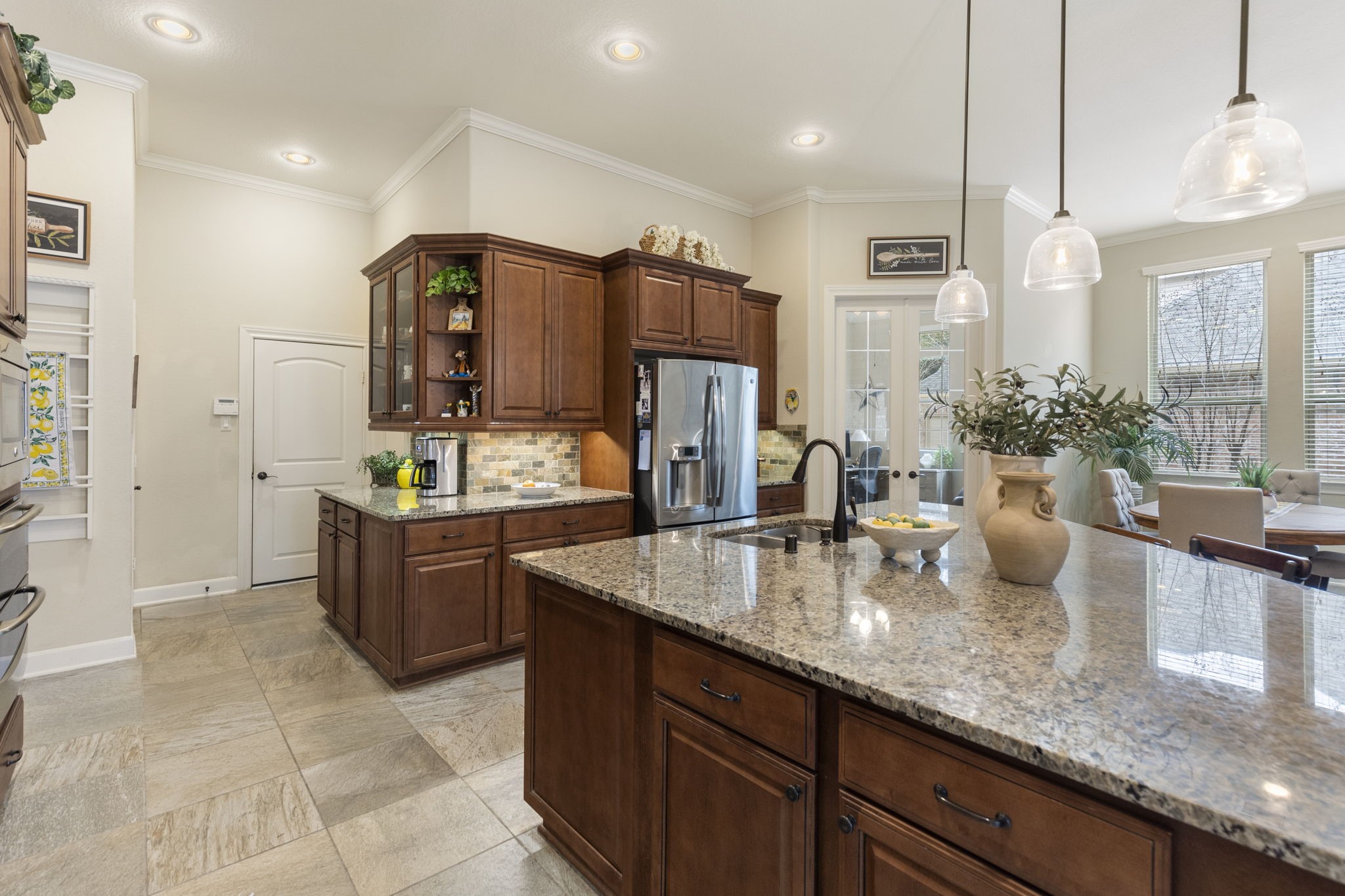 4787 Jackson Square Drive Conroe, TX 77304 - Photo 10 of 41 Step into a kitchen where storage dreams come true! Thoughtfully designed with an abundance of cabinets, drawers, and clever nooks, this space ensures everything has its place—no more cluttered countertops or overflowing shelves. From sleek cabinetry for your dinnerware to deep drawers perfect for pots and pans, every inch has been optimized for functionality and style. Whether you're a culinary enthusiast or just love an organized home, this kitchen is ready to keep up with your lifestyle.