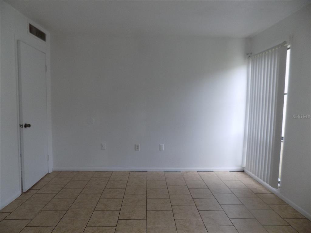 2811 Southwest Archer Road, Unit X 201 Gainesville, FL 32608 - Photo 23 of 29 a view of an empty room and window