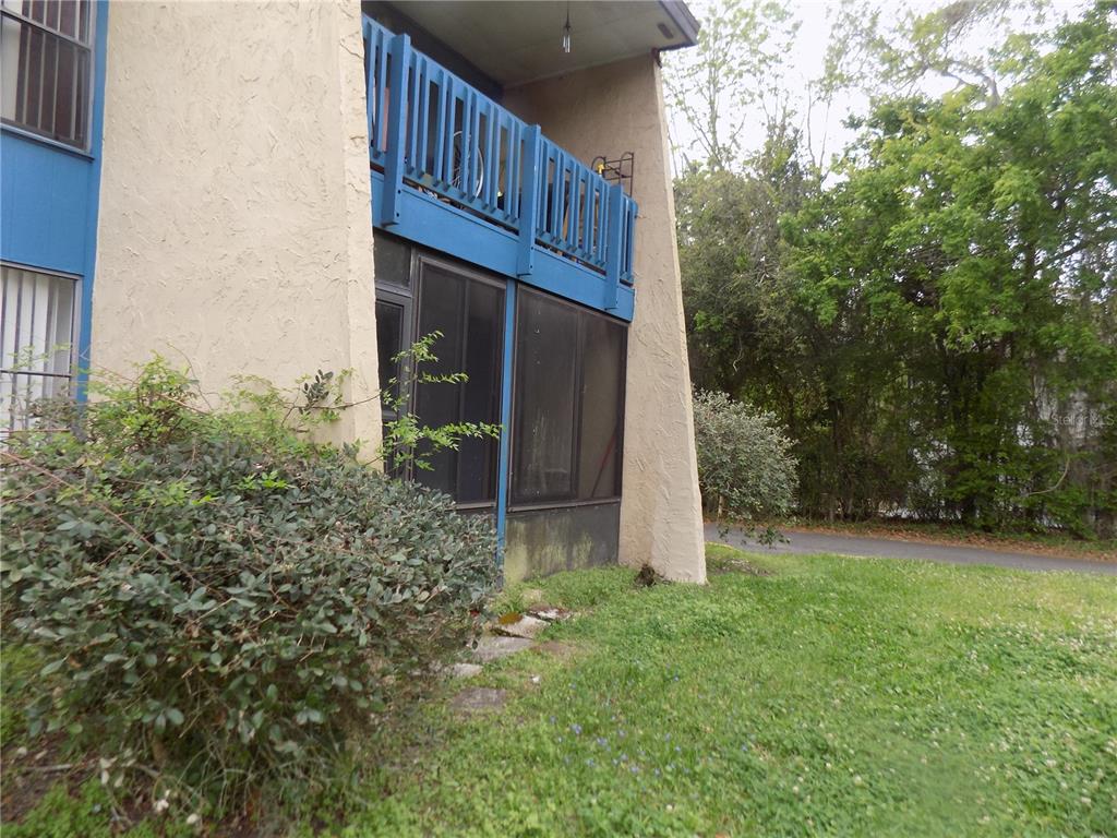 2811 Southwest Archer Road, Unit X 201 Gainesville, FL 32608 - Photo 29 of 29 a view of a house with a yard