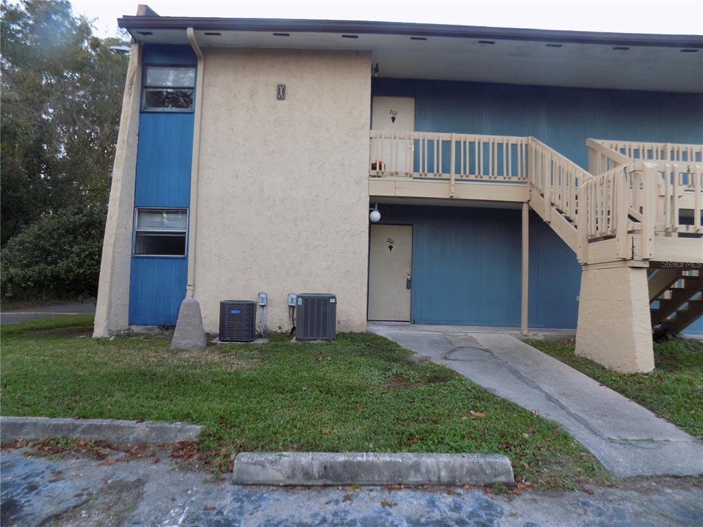 2811 Southwest Archer Road, Unit X 201 Gainesville, FL 32608 - Photo 4 of 29 a view of front of a house with a yard