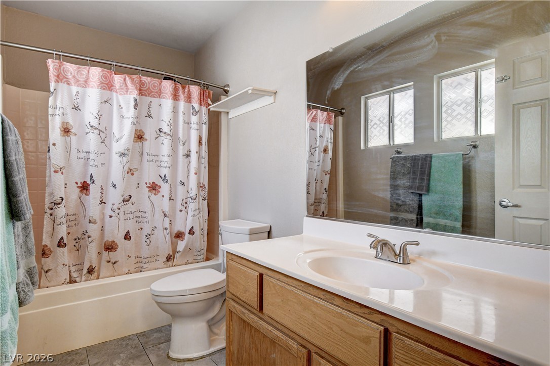 910 Cobblestone Cove Road North Las Vegas, NV 89081 - Photo 20 of 30 Functional full bathroom featuring a tub-shower combination, a vanity with a sink, and essential fixtures.