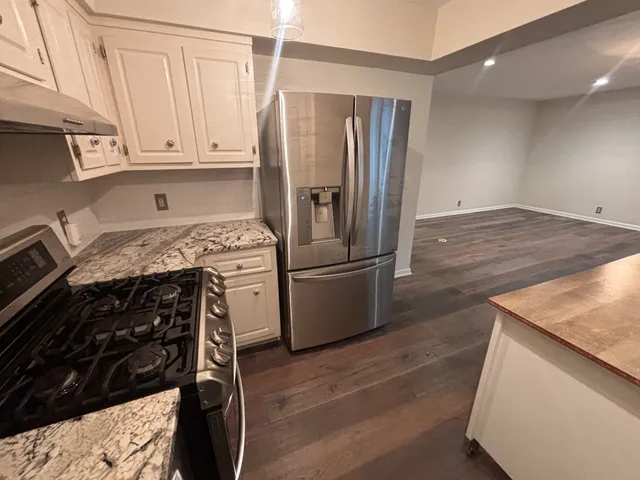 a kitchen with a stove microwave and refrigerator