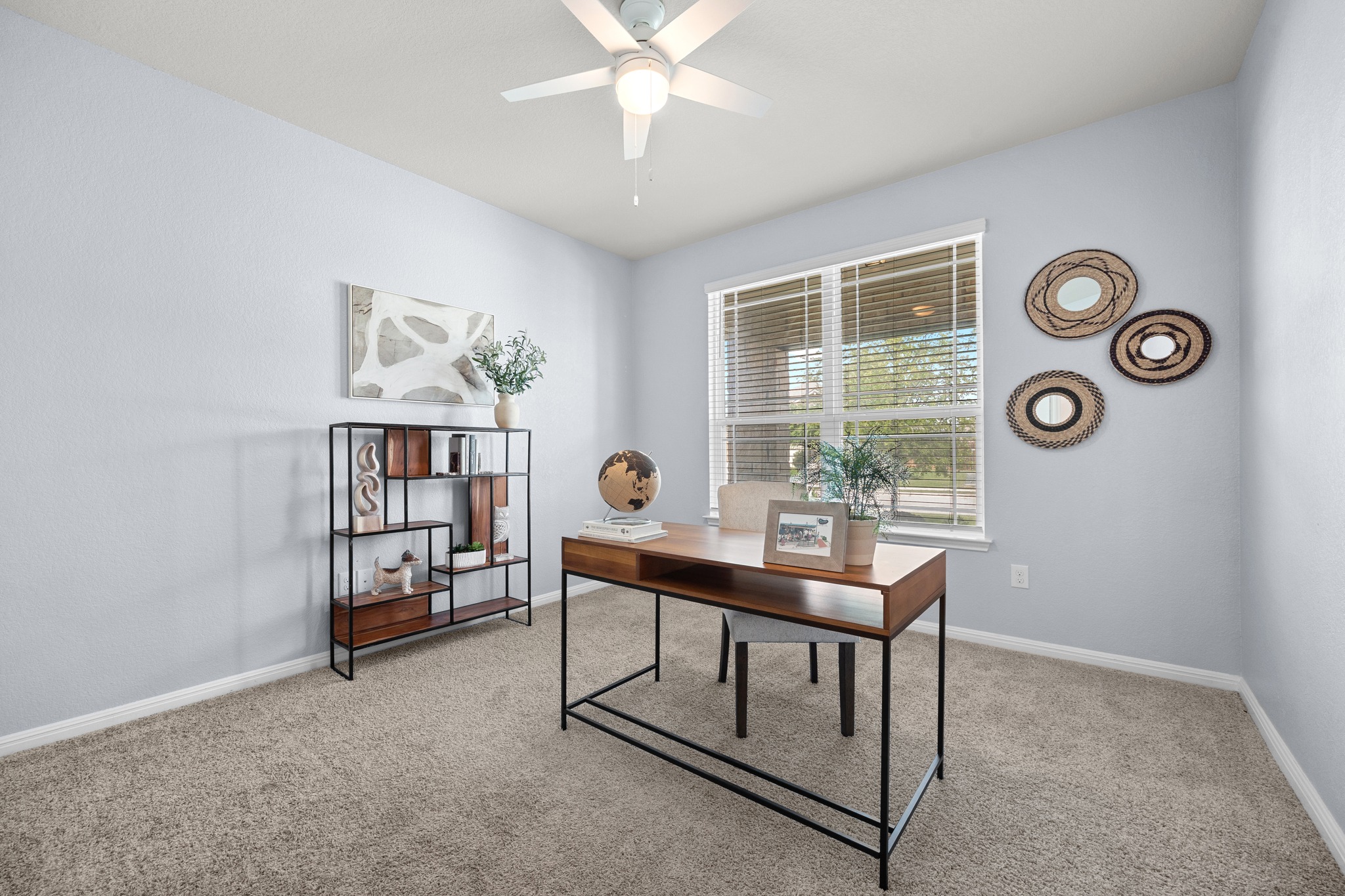 2413 Starhill Ranch Street Georgetown, TX 78628 - Photo 10 of 40 a view of a workspace with furniture and a window