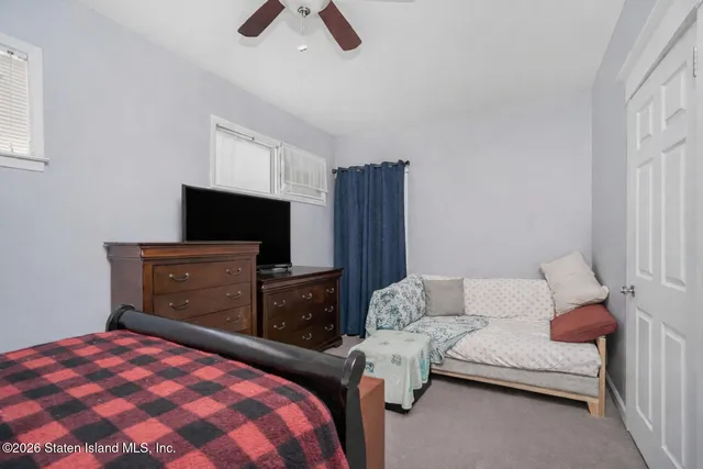 a bedroom with a bed and furniture