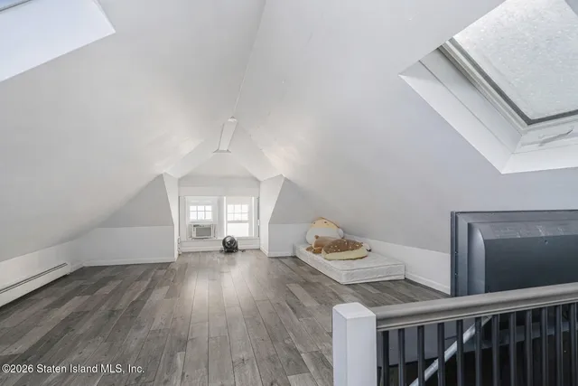 a view of a livingroom with wooden floor