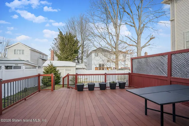 a view of a house with wooden deck