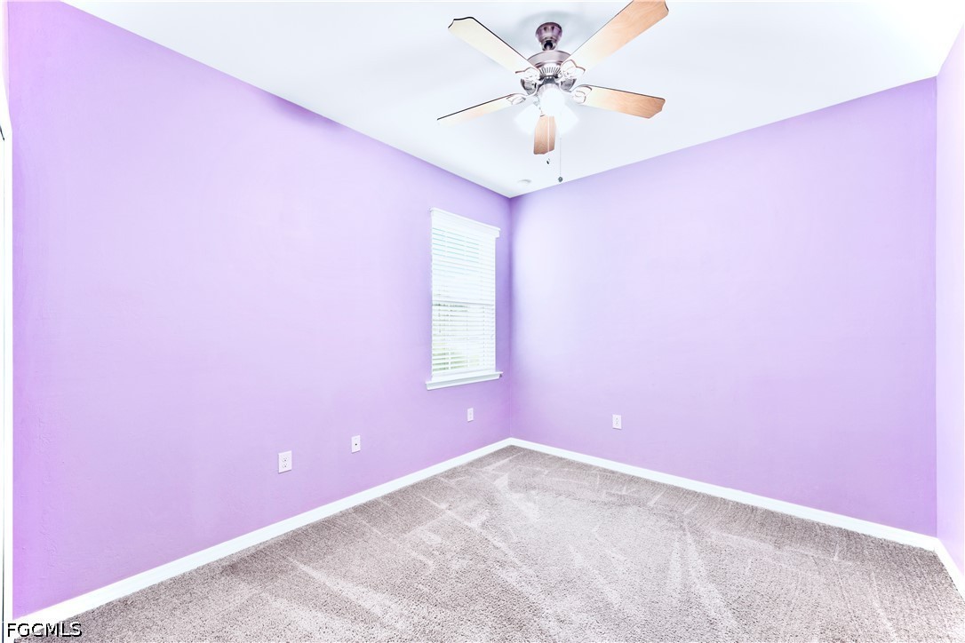 10781 Crossback Lane Lehigh Acres, FL 33974 - Photo 14 of 28 an empty room with a window