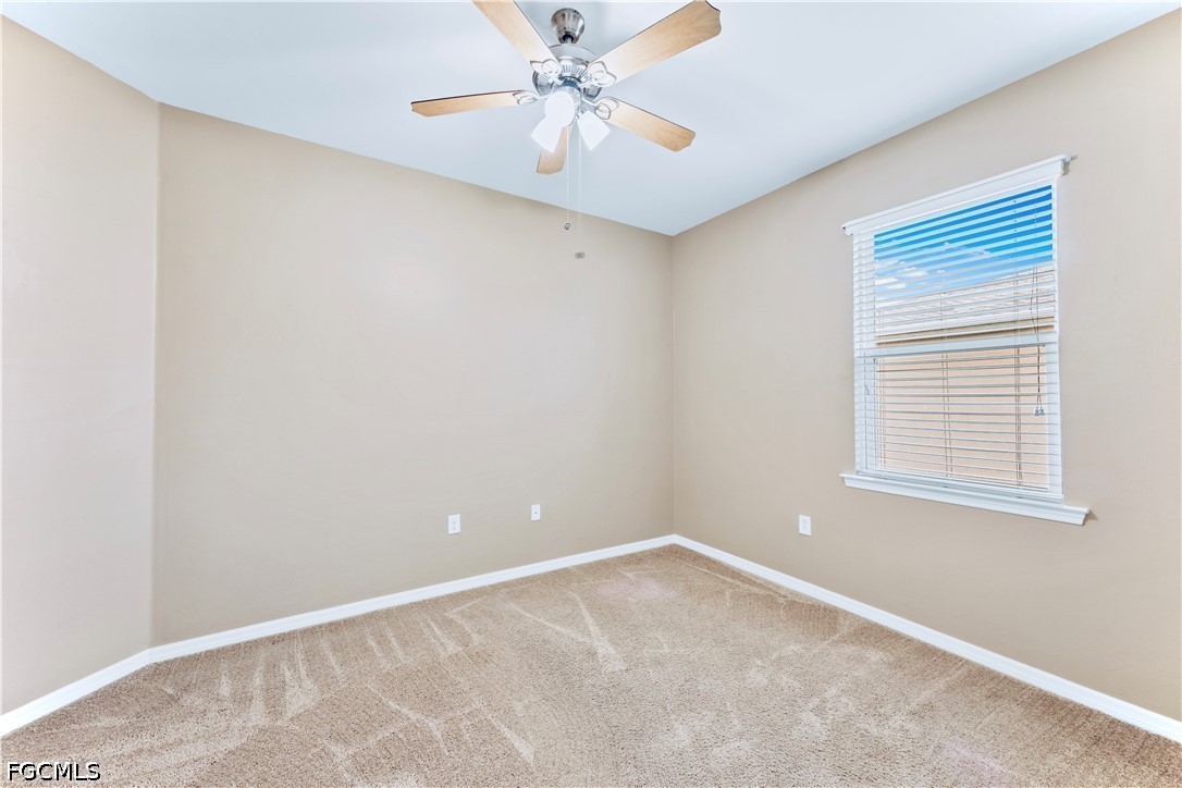 10781 Crossback Lane Lehigh Acres, FL 33974 - Photo 17 of 28 a view of an empty room with a window