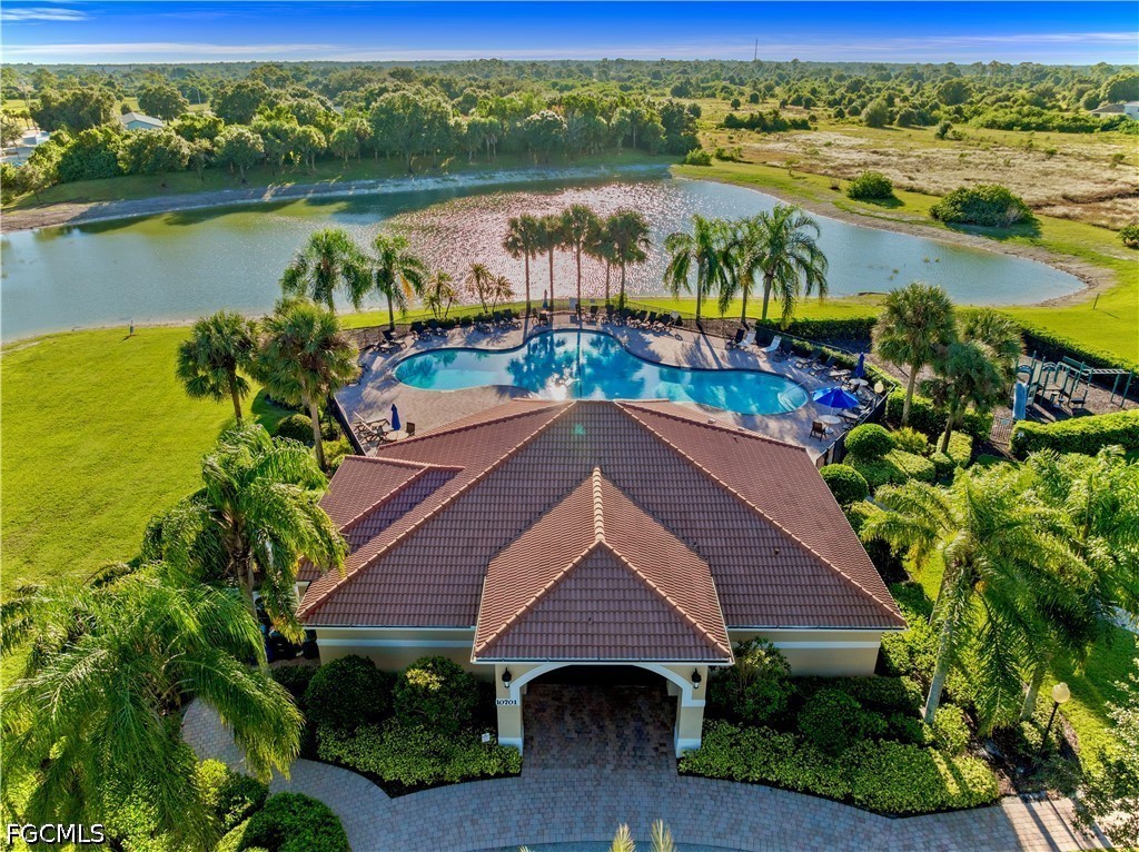10781 Crossback Lane Lehigh Acres, FL 33974 - Photo 24 of 28 a aerial view of a house with a lake view