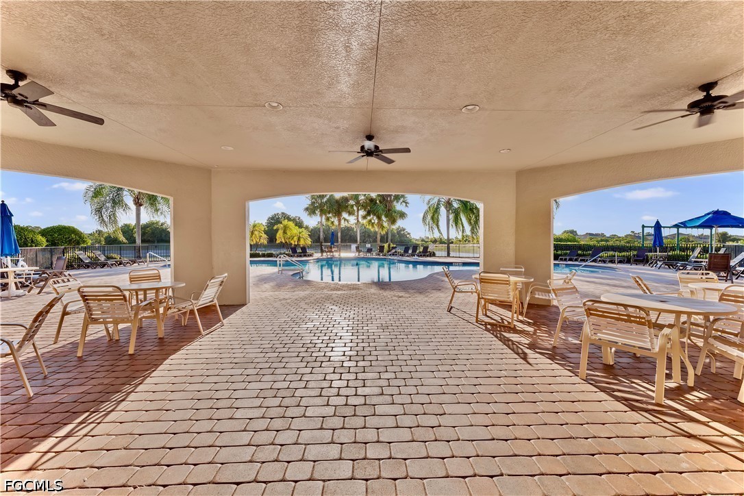 10781 Crossback Lane Lehigh Acres, FL 33974 - Photo 26 of 28 a view of a swimming pool and outdoor space
