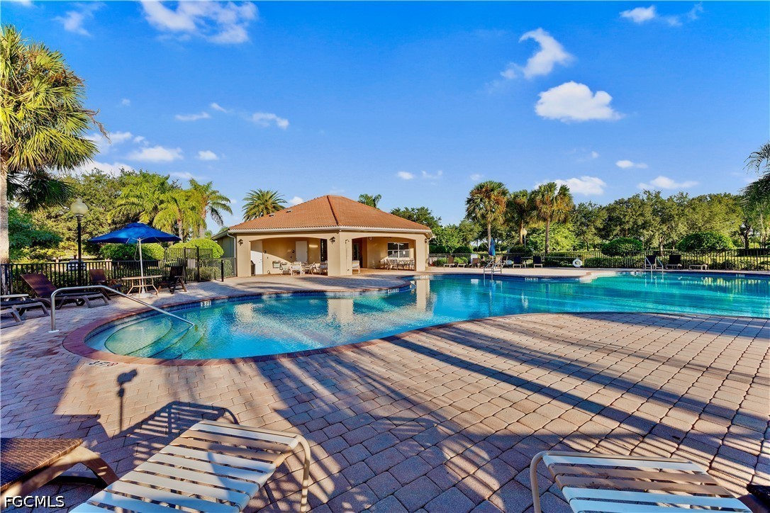 10781 Crossback Lane Lehigh Acres, FL 33974 - Photo 27 of 28 a view of a house with a yard