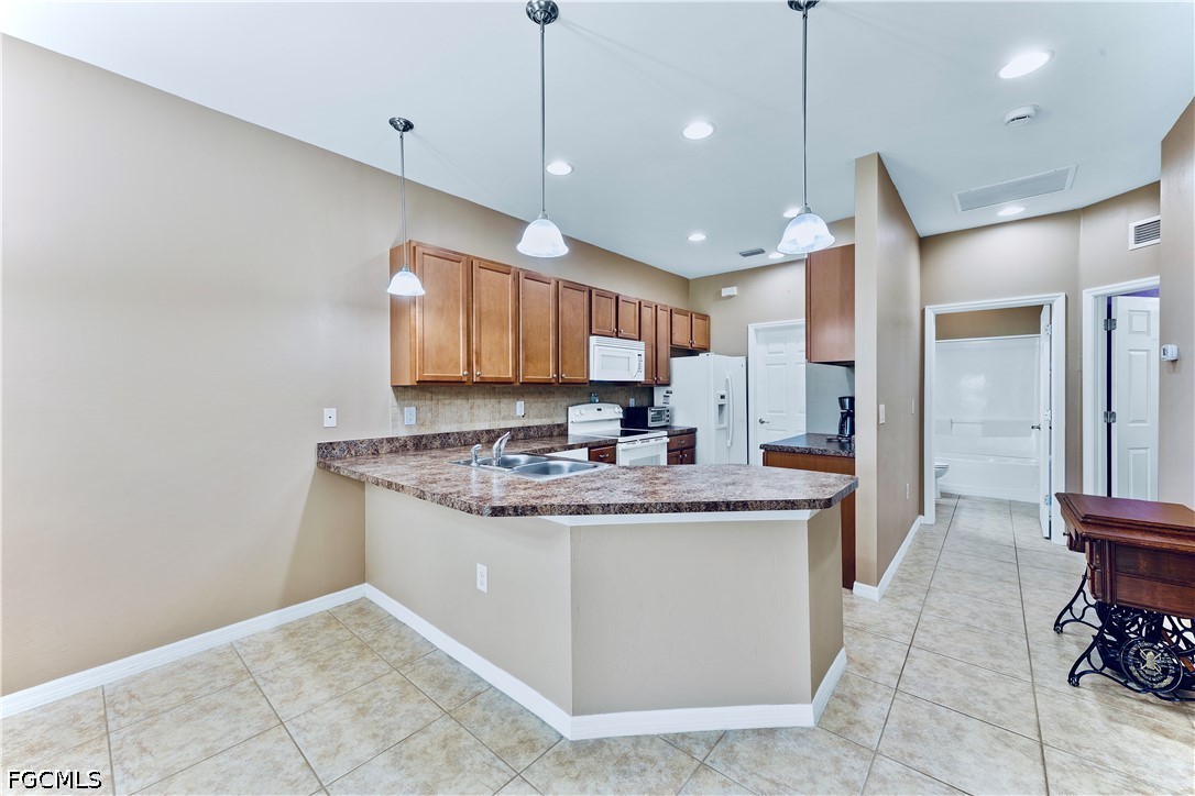 10781 Crossback Lane Lehigh Acres, FL 33974 - Photo 5 of 28 a view of a kitchen and a sink